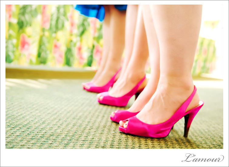 Bright blue bridesmaids dresses with hot pink shoes. A perferct color theme for an Oahu wedding.